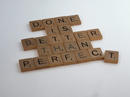 "Done is better than perfect spelled out" on Scrabble tiles; how to delegate