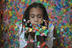 Woman Blowing Confetti